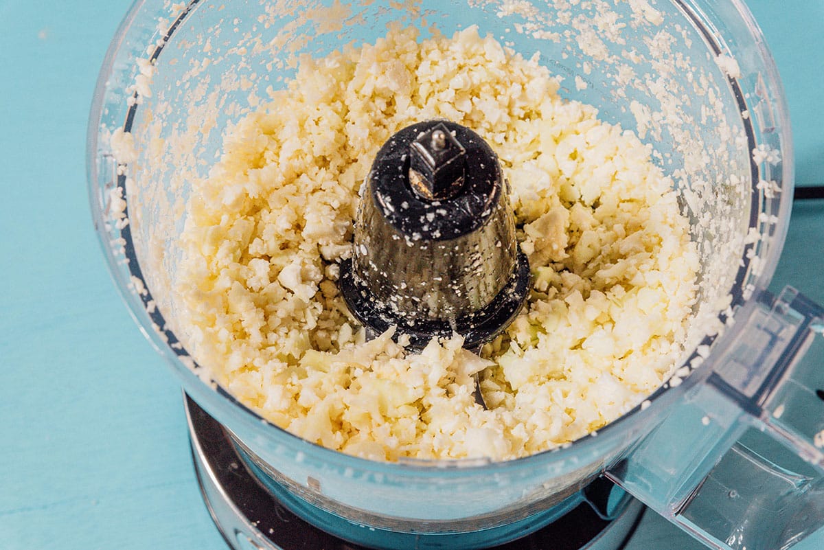 Making cauliflower rice in a food processor.
