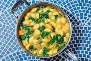 Gnocchi soup in a pan.