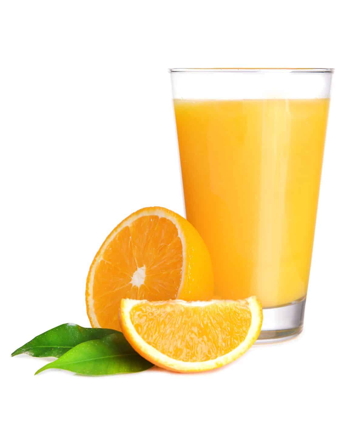 Orange juice in a glass on a white background.