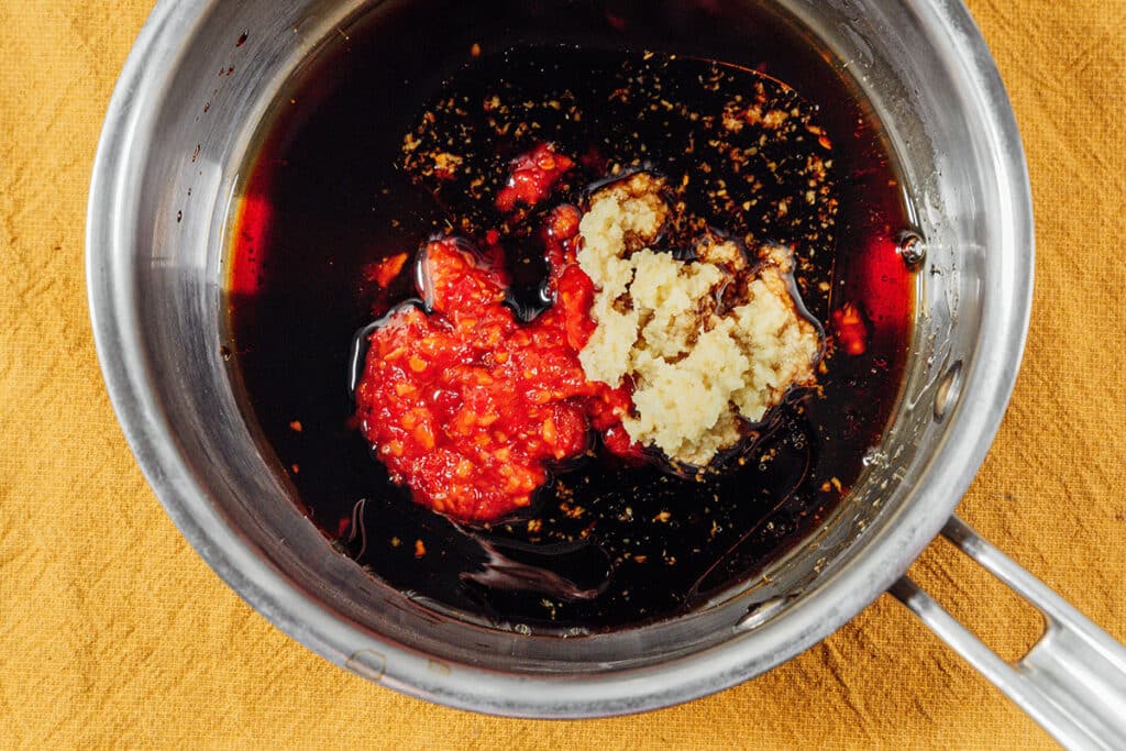 Soy sauce with spices in a pot.