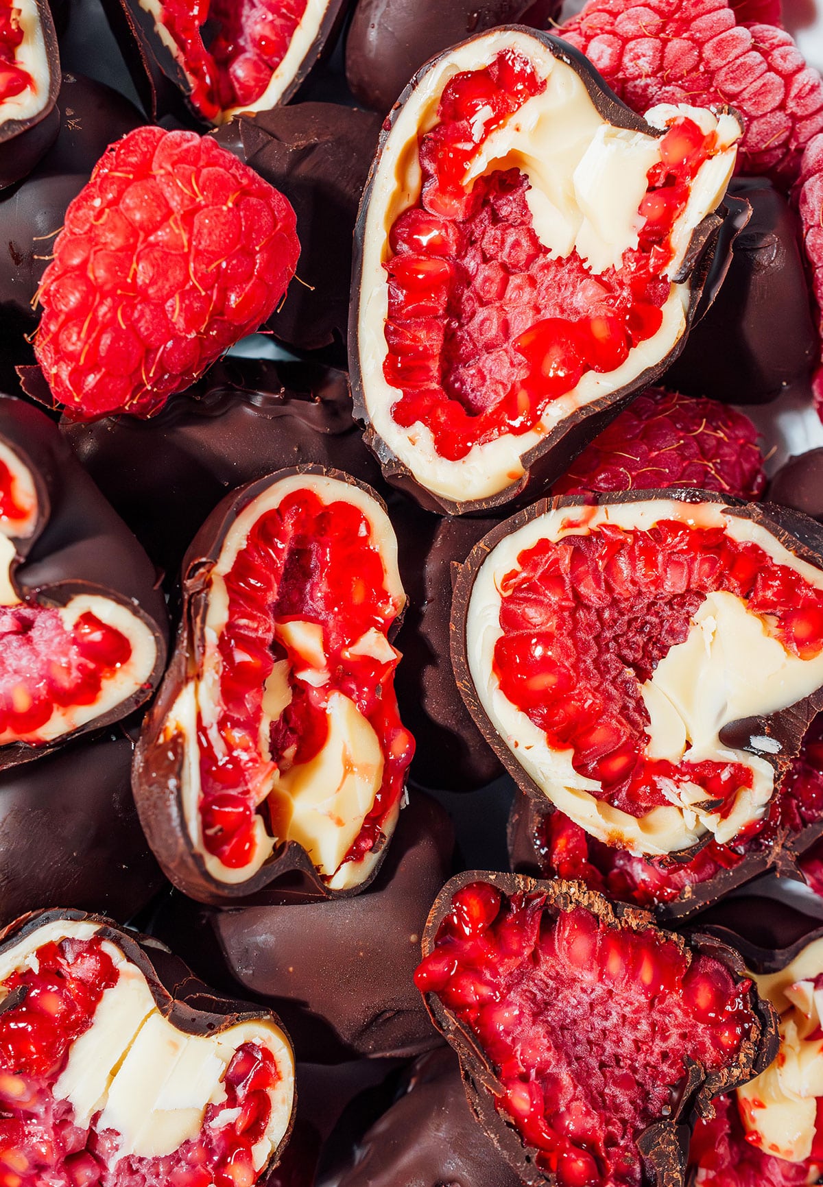 Chocolate covered raspberries closeup.