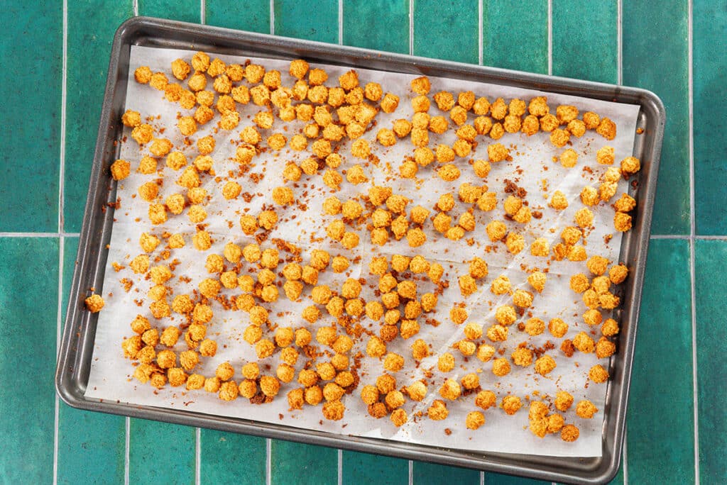 Baking chickpeas on a pan.