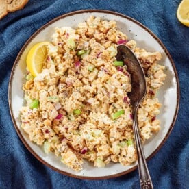 Chickpea tuna salad on a serving plate with a spoon.