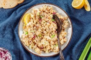Chickpea tuna salad on a serving plate with a spoon.