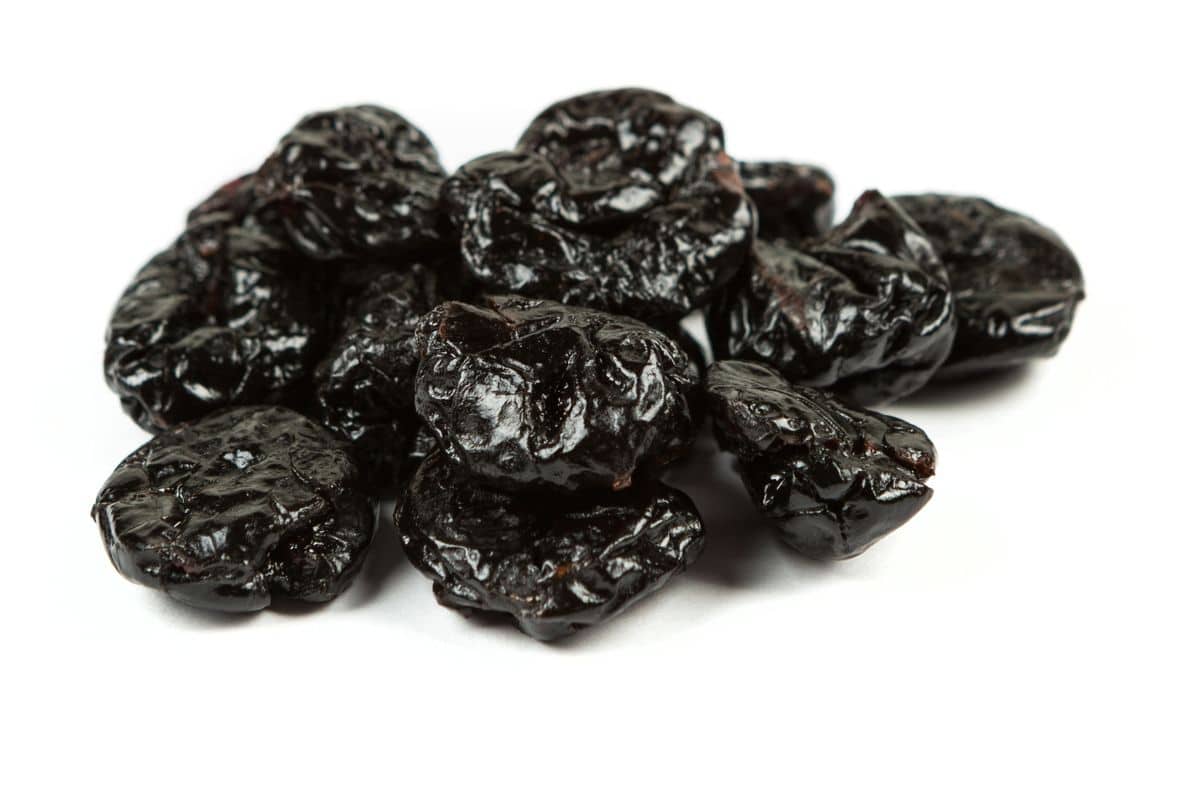 A stack of dried cherries on a white background.