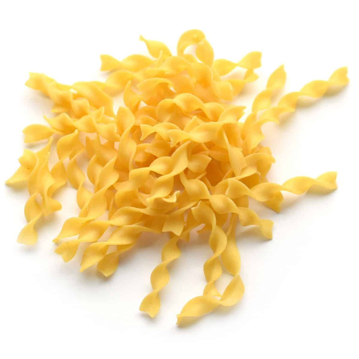 Egg noodles on a white background.