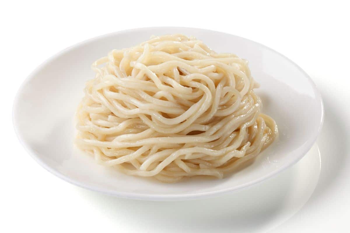Hiyamugi noodles in a bowl on a white background.