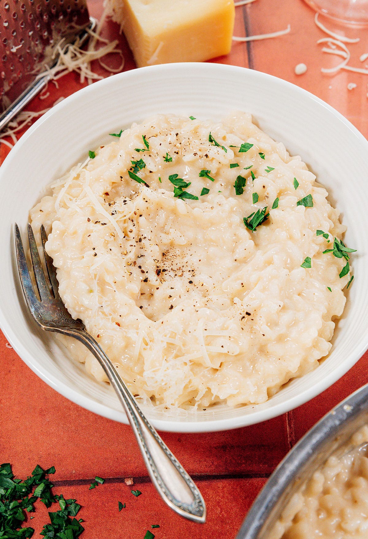 Risotto in a bowl with a spoon.
