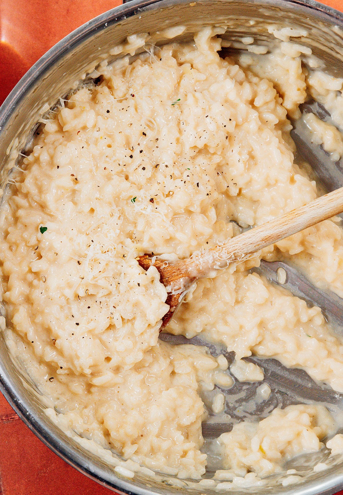 Risotto in a pan with a spoon.