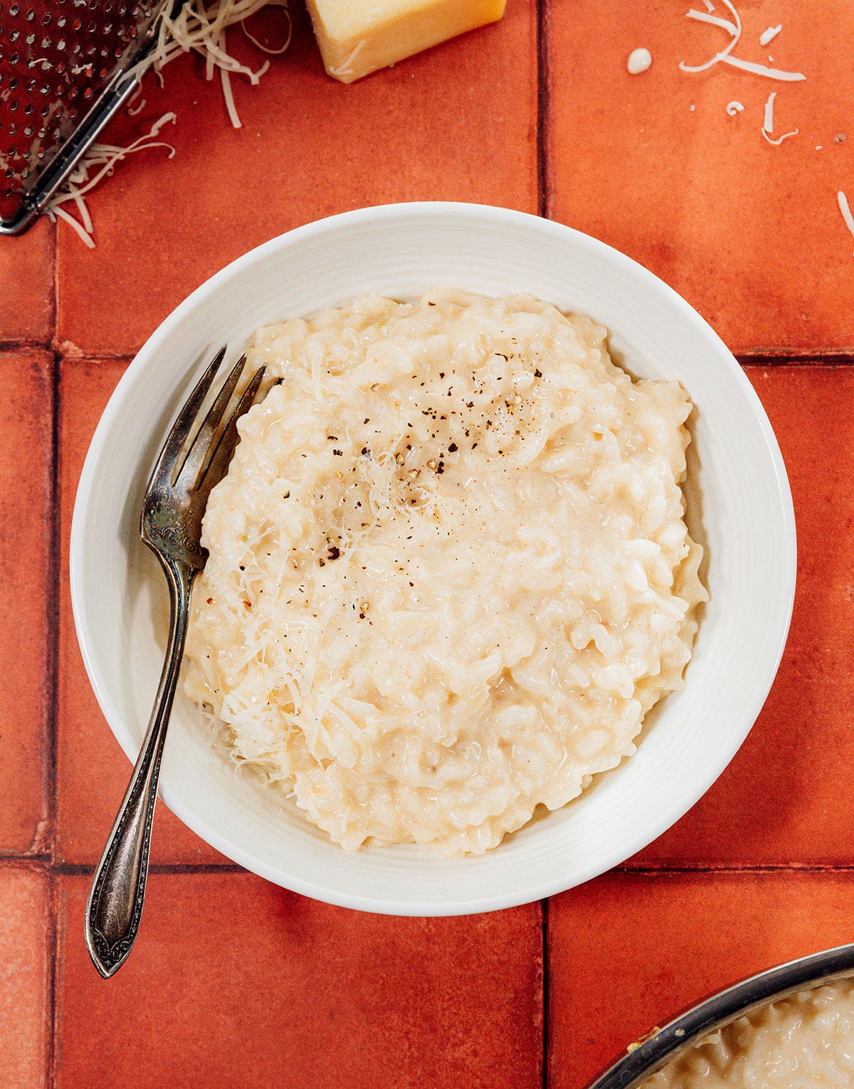Risotto in a bowl with a spoon.