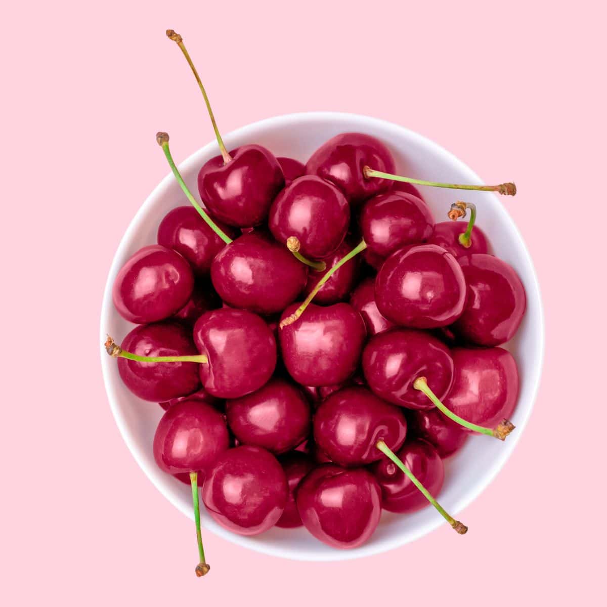 A bowl of magenta cherries.