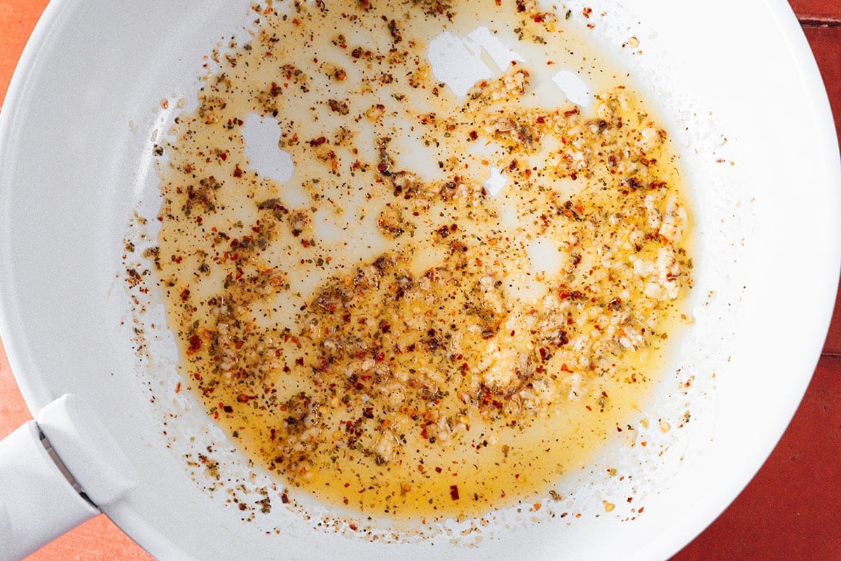 Garlic and spices in a pan.