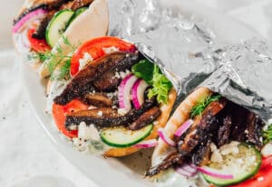 Portobello mushroom gyros in foil.
