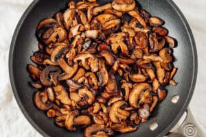 Cooking mushrooms in a pan.