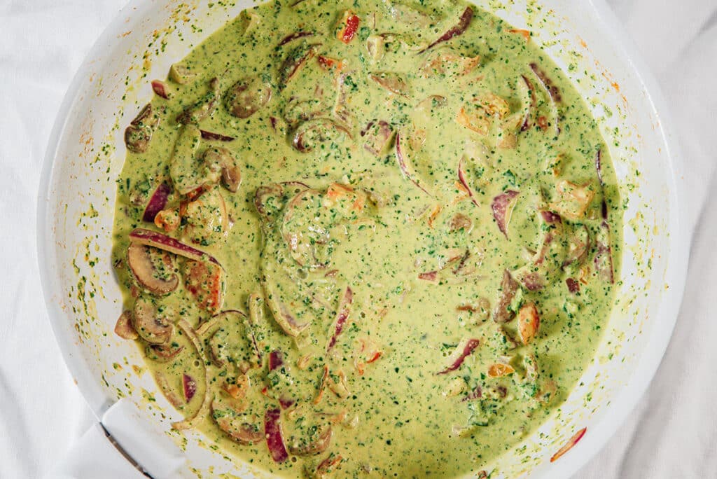 Pesto sauce in a white pan.