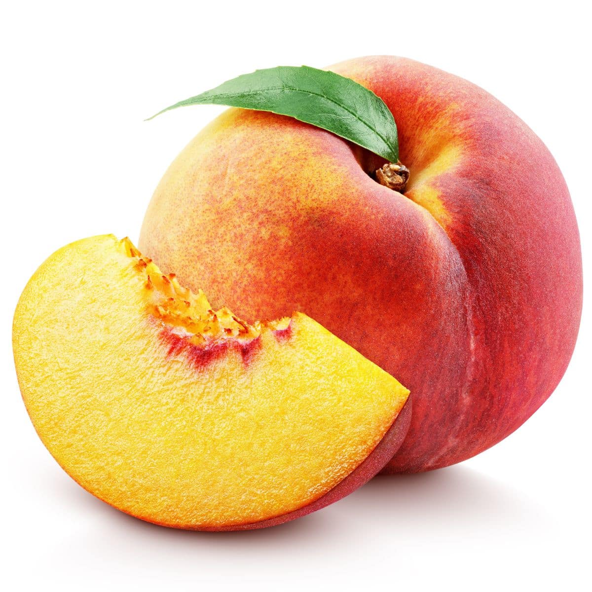 Red haven peach on a white background.