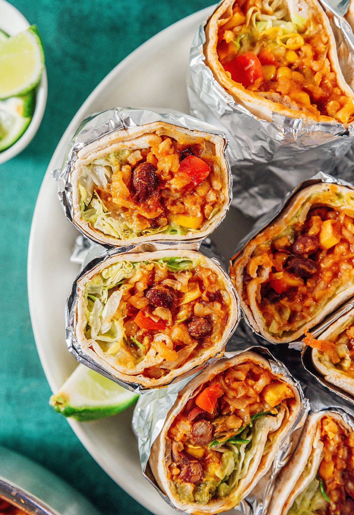 Vegan burritos wrapped in foil.