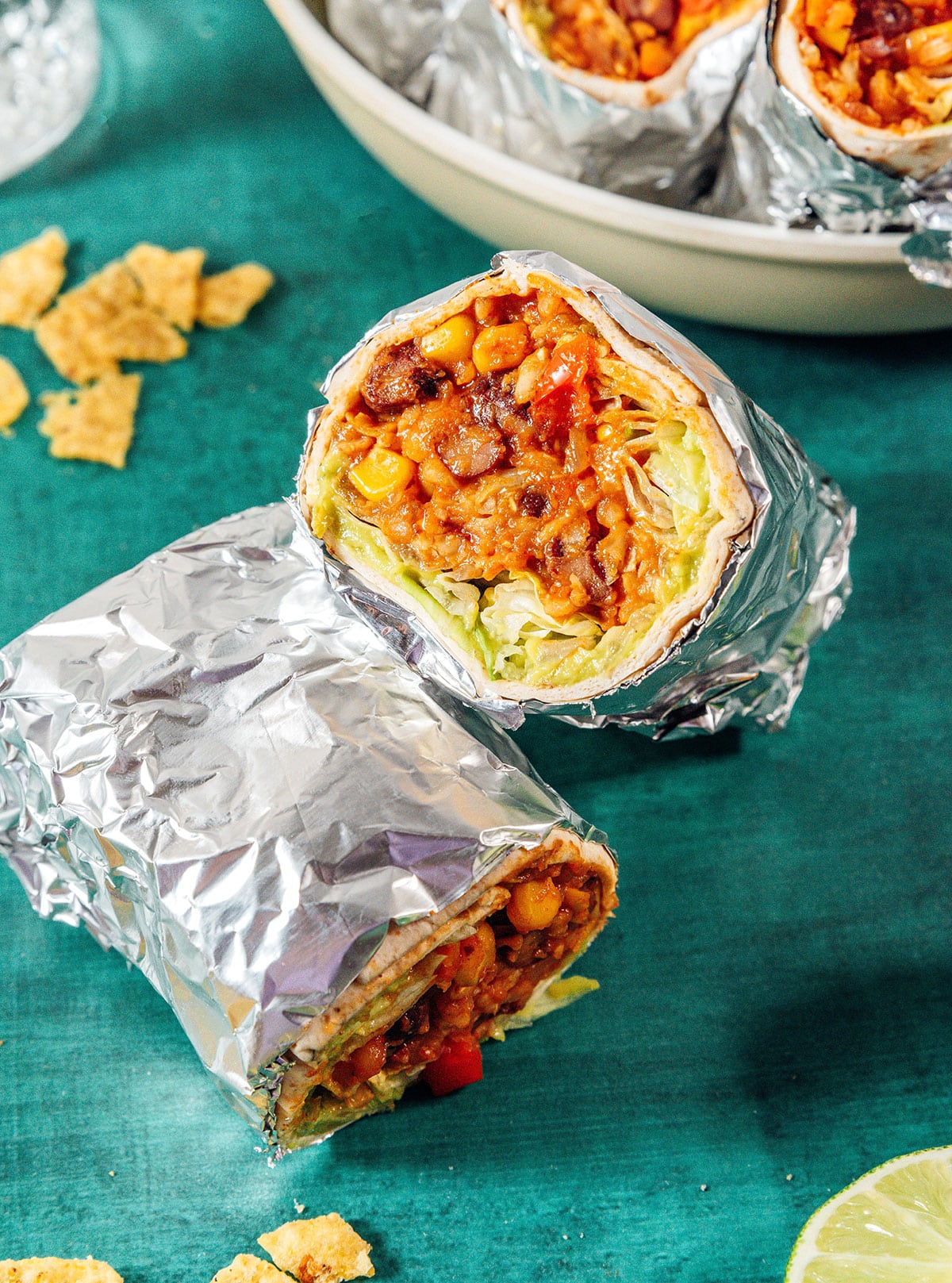Vegan burritos wrapped in foil.