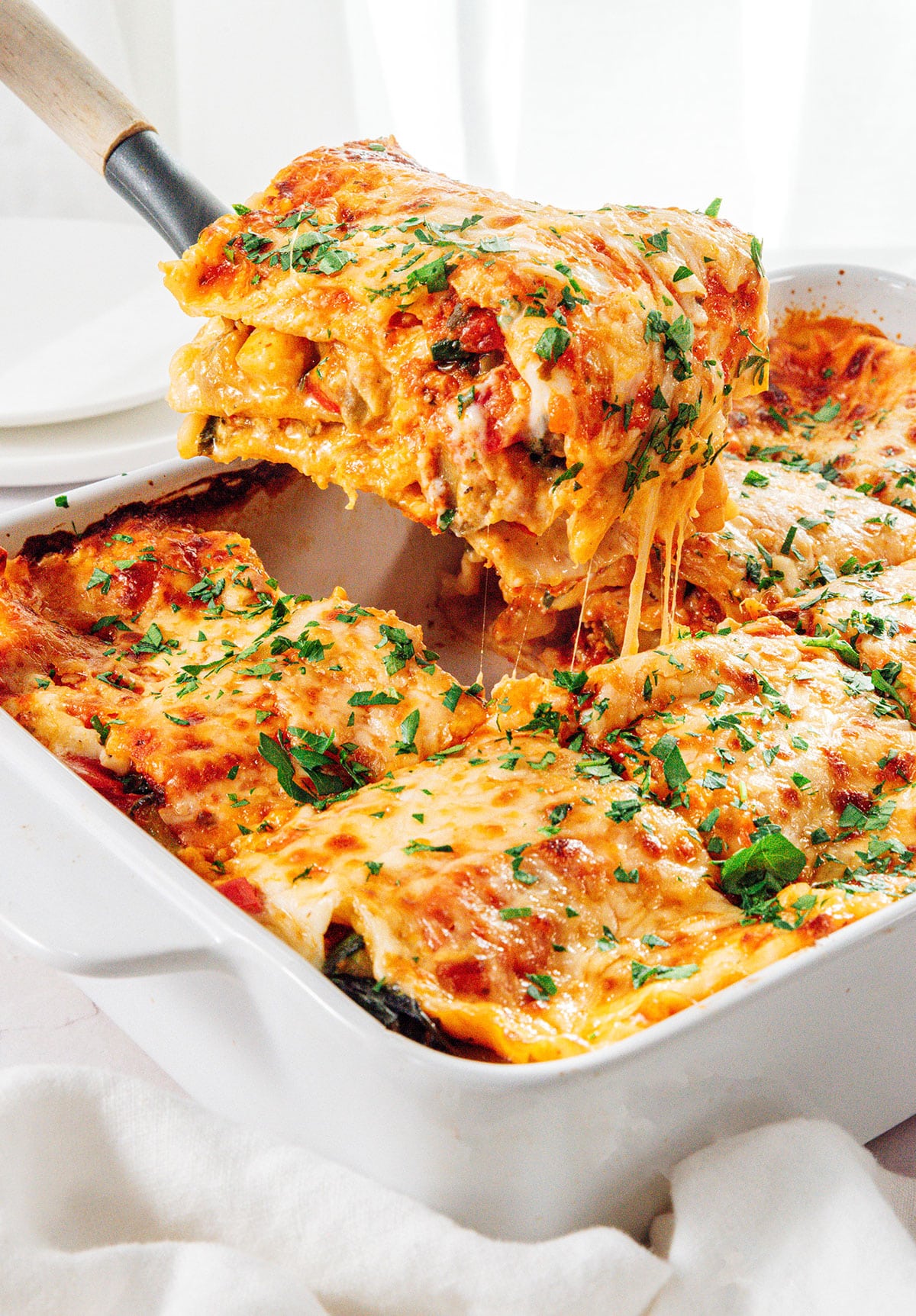Vegetable lasagna in a casserole dish.