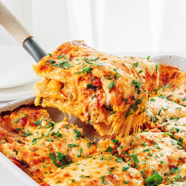Vegetable lasagna on a serving spatula.