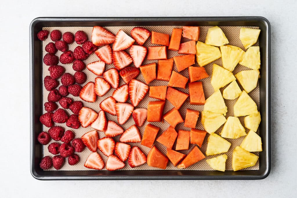 Freezing fruit in a single layer.