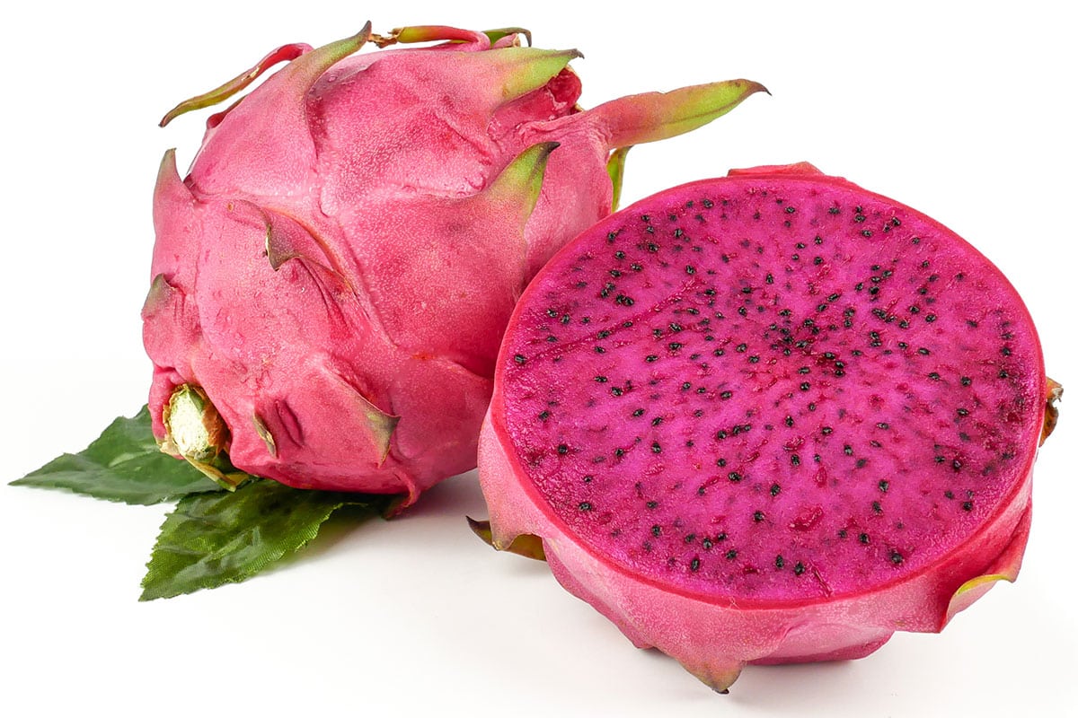 Pink dragon fruit on an isolated white background.