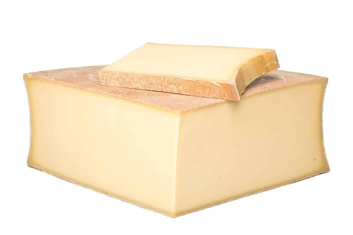 Beaufort cheese on a white background.