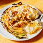 Cabbage steak on a plate.