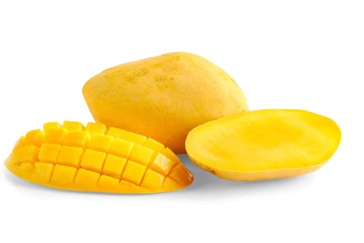 Carabao mangoes on a white background.
