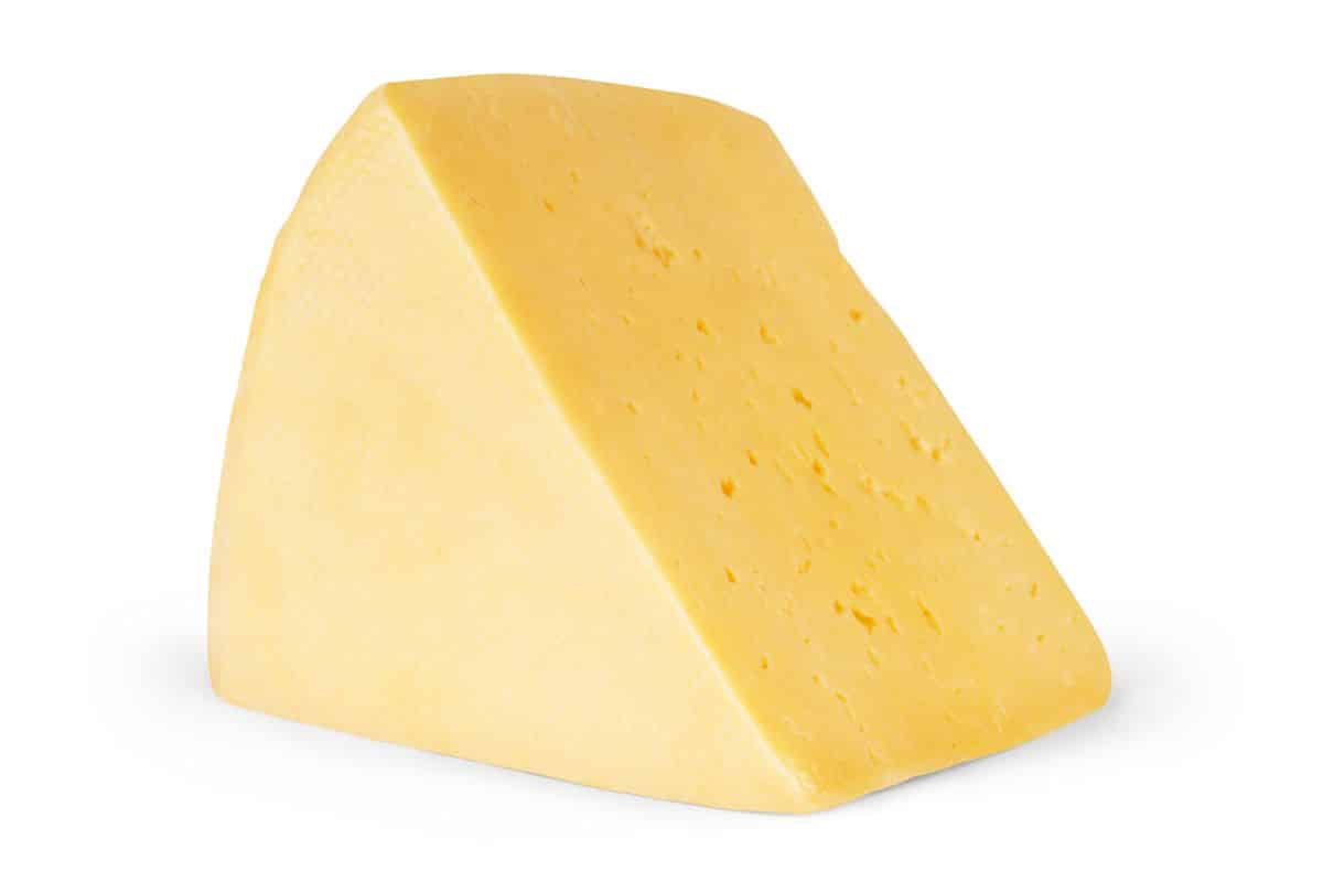 Engleberg cheddar cheese on a white background.