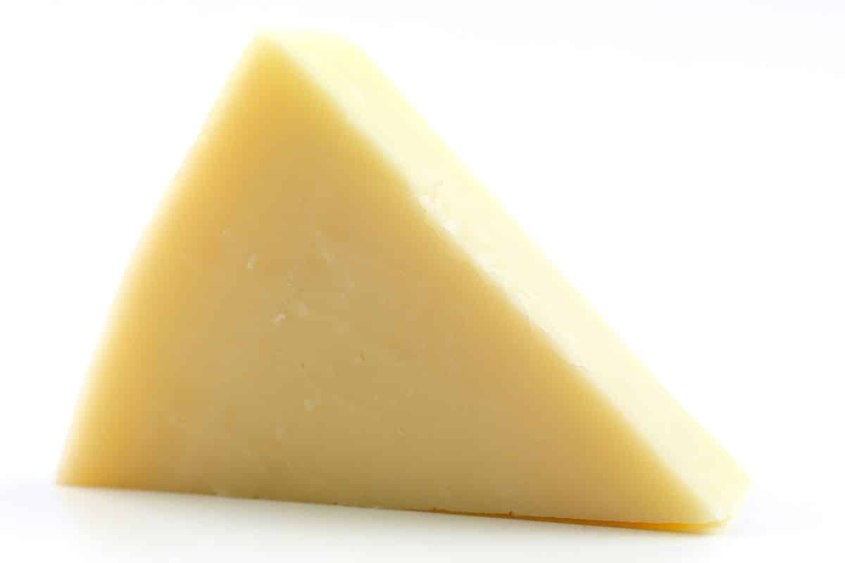 Graviera cheese on a white background.