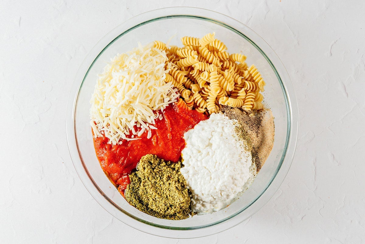 Ingredients for rotini bake in a bowl.