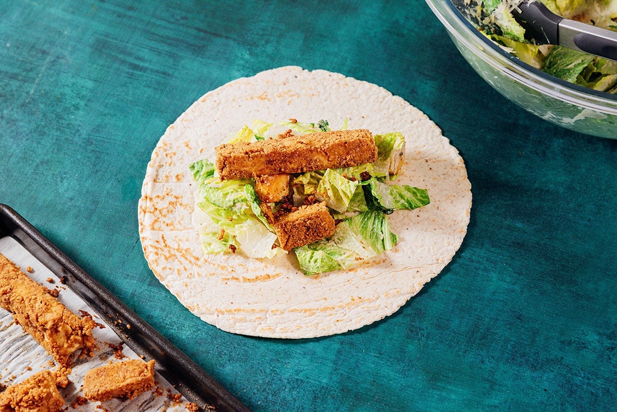 Vegan chicken caesar wraps on a tortilla wrap.
