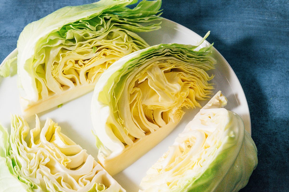Cabbage wedges on a plate.