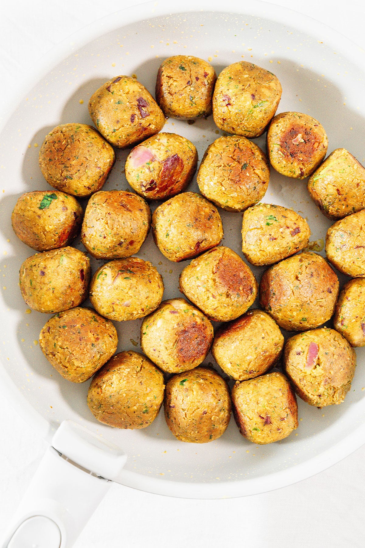 Chickpea meatballs in a pan.
