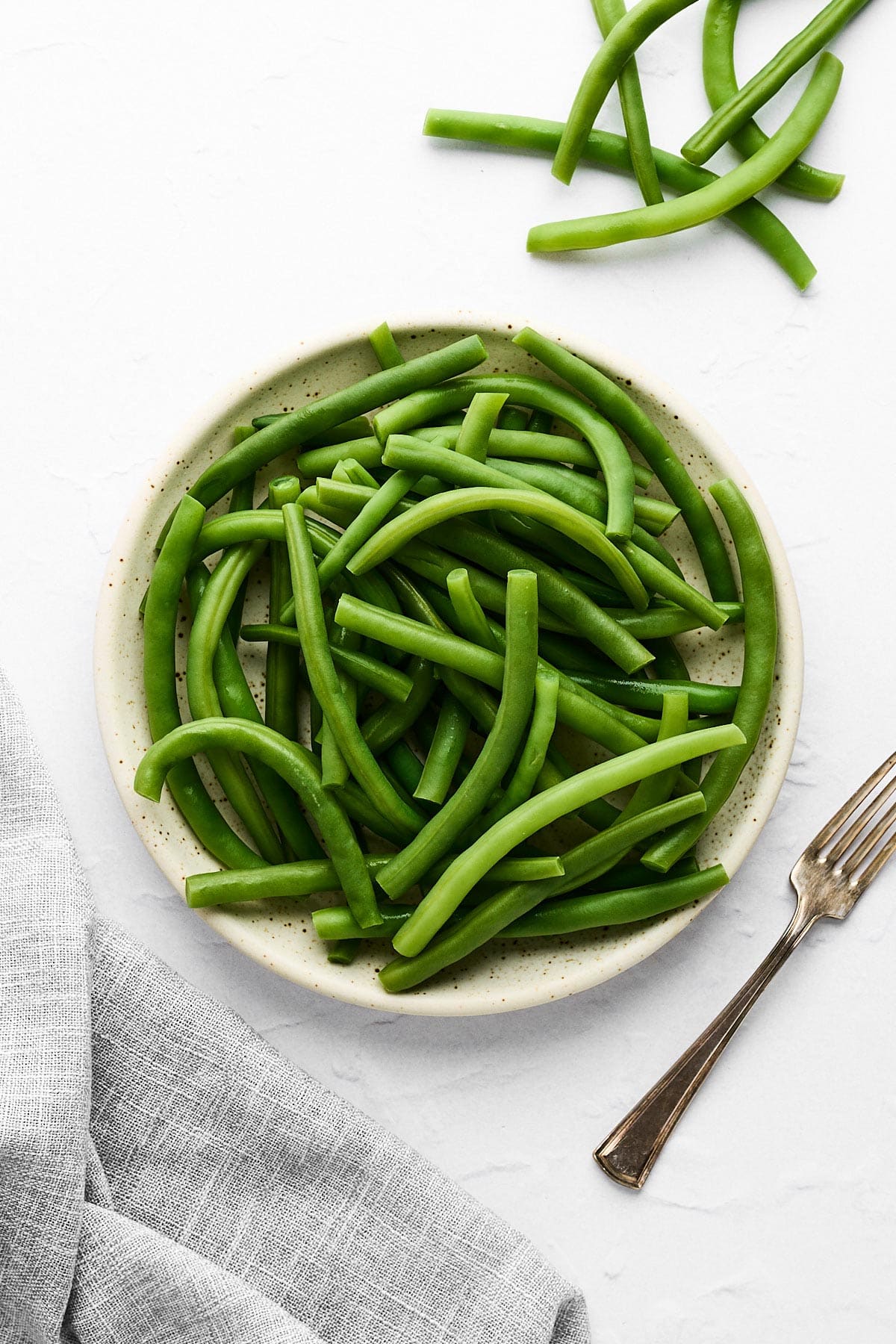 Blanched green beans in a bowl.