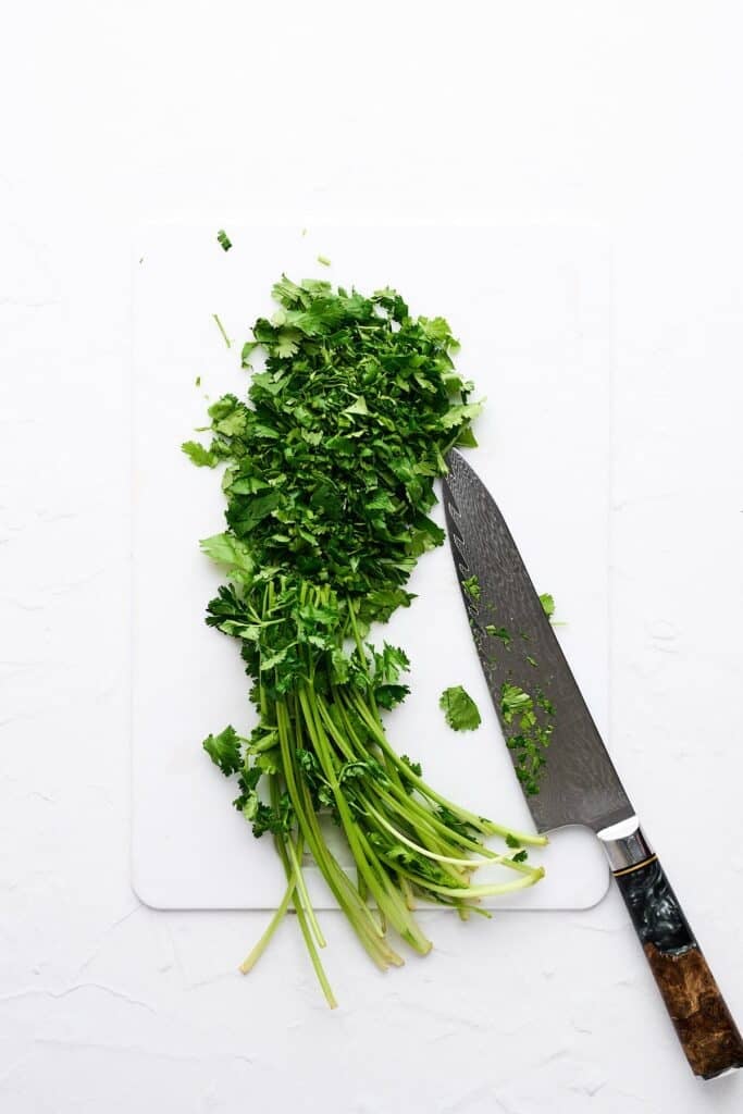 Chopped cilantro and a knife.