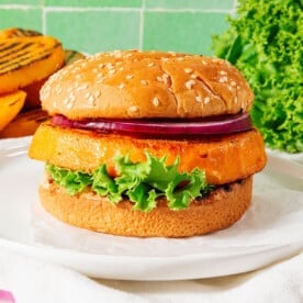 Rutabaga burgers with a green tile background.