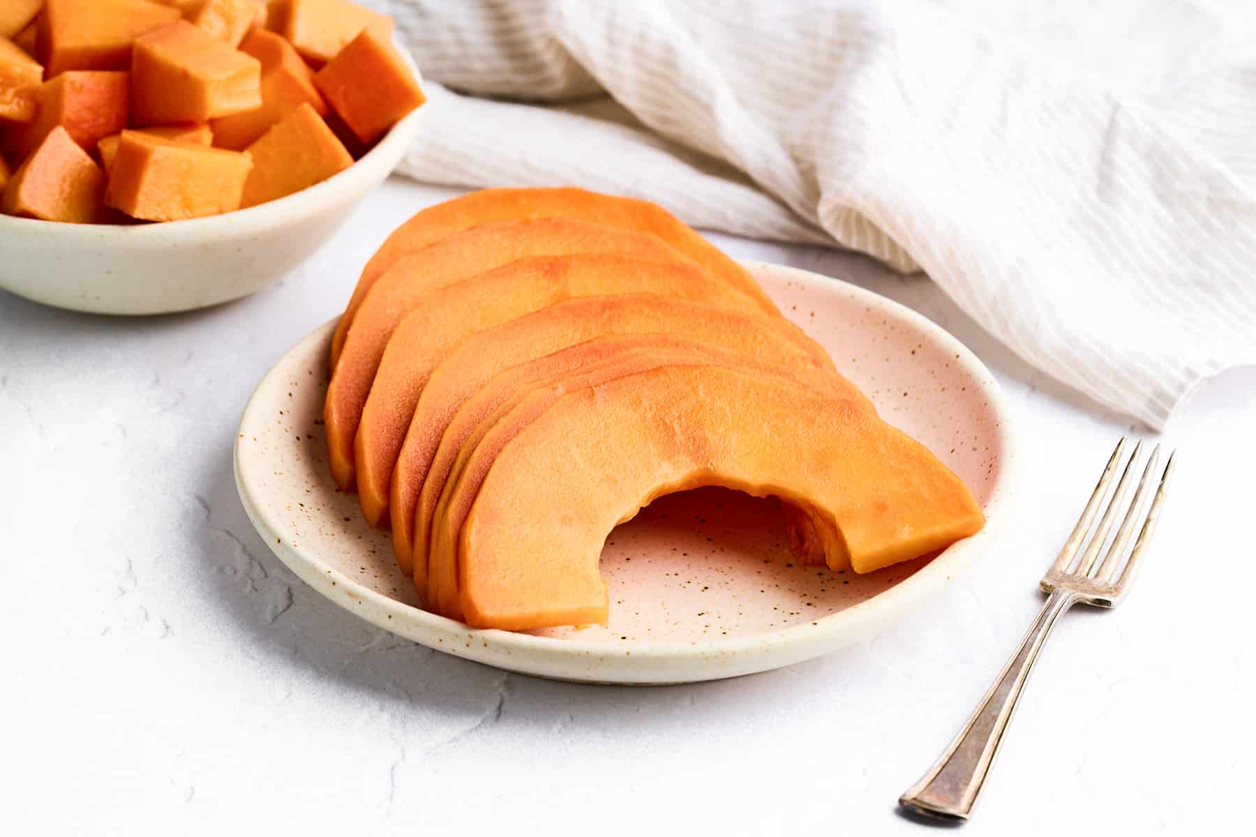 Cut papaya on a plate.