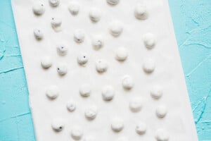Frozen yogurt blueberry bites on baking sheet.