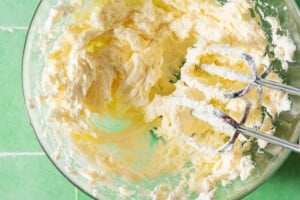 Whipping ingredients to make Boursin cheese.