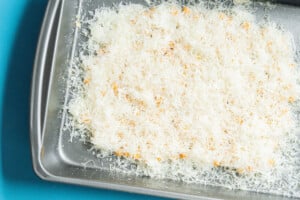 Chickpeas covered in parmesan in a pan.
