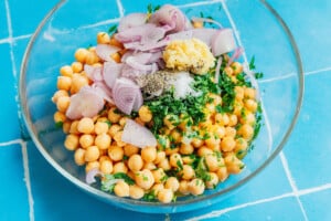 Ingredients for marinated chickpeas in a bowl.