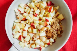 Ingredients for stewed apples in a pan.
