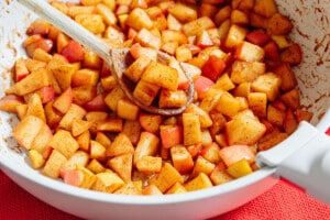 Close up of stewed apples on a spoon.