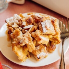 Almond French toast casserole bake on a serving plate.