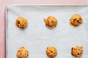 Cookie dough on a baking sheet.
