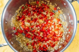 Sautéing veggies in a pot for corn chowder.