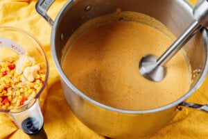 Blending soup in a pot.