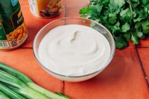 Sauce for Mexican street corn salad in a bowl.